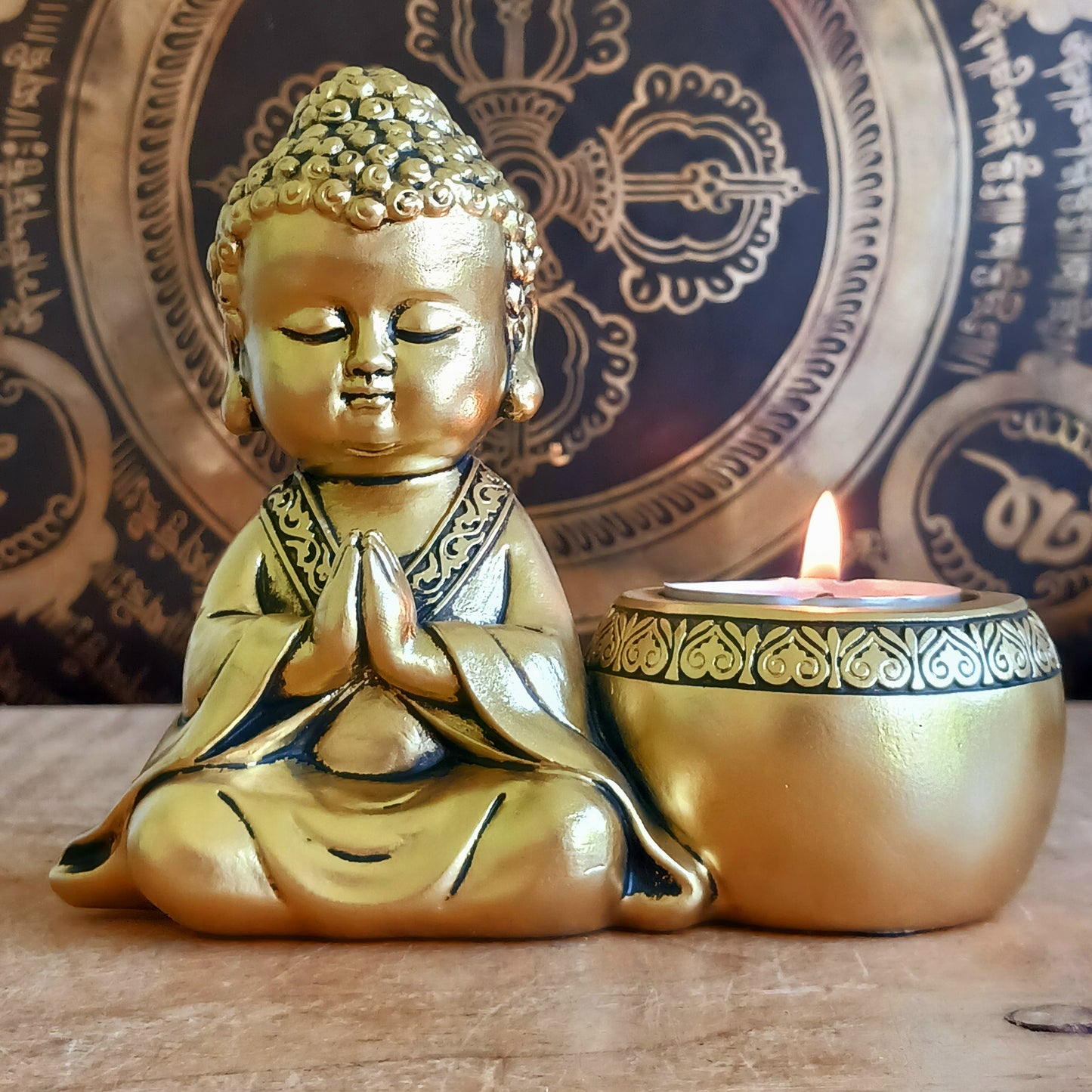 Bring a sense of peace and mindfulness into your home with this elegant Gold Buddha Tealight Candle Holder. Featuring a beautifully crafted praying Buddha figure alongside a tealight holder, this decorative piece creates a calming ambiance wherever it is placed.