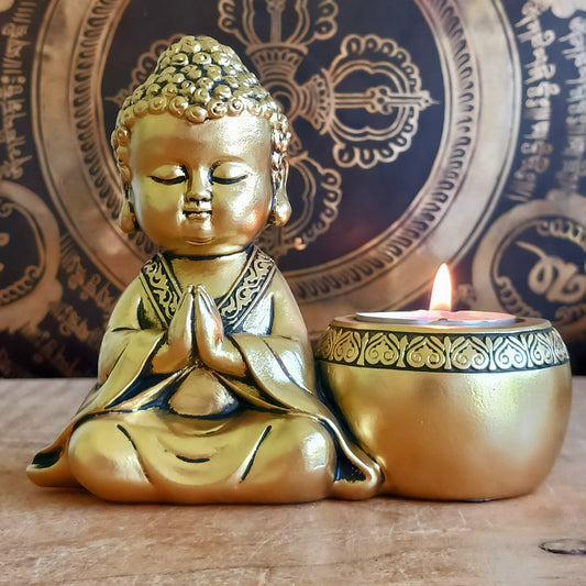 Bring a sense of peace and mindfulness into your home with this elegant Gold Buddha Tealight Candle Holder. Featuring a beautifully crafted praying Buddha figure alongside a tealight holder, this decorative piece creates a calming ambiance wherever it is placed.