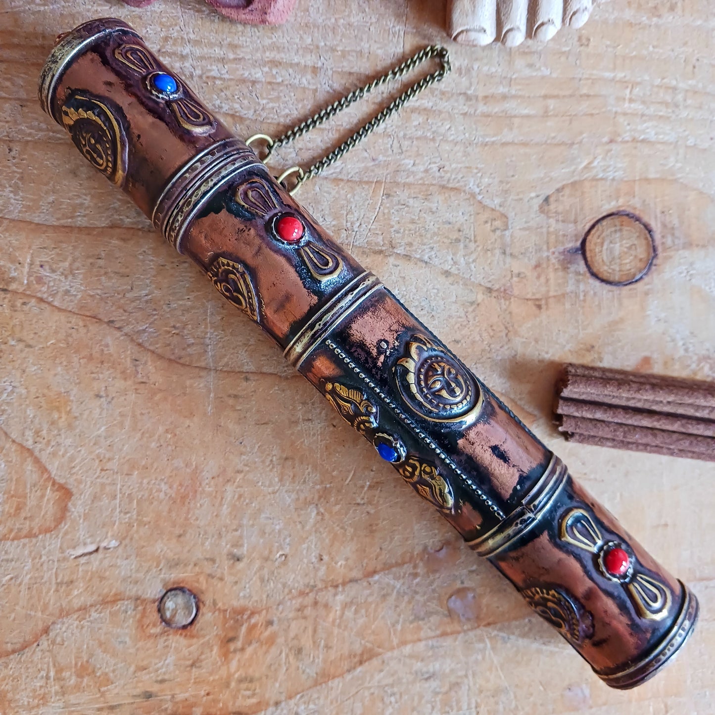 Introducing the Dorje Tibetan Incense Holder, a meticulously handcrafted ritual accessory designed to elevate your incense experience. This exquisite incense holder is not only a functional storage solution but also a captivating piece of art. Carefully crafted and adorned with brass dorjes and auspicious symbols, it exudes a sense of spiritual elegance.