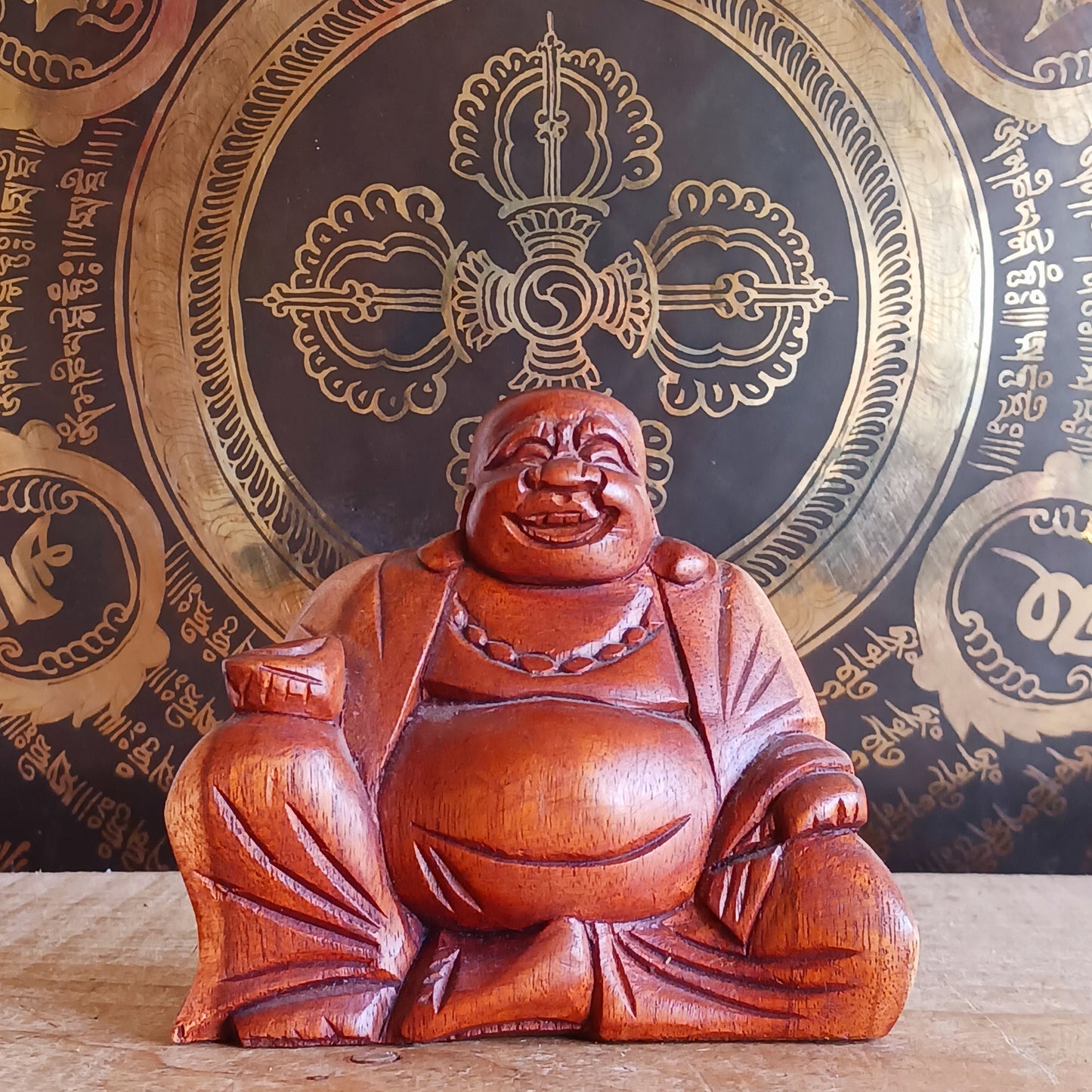 Bring joy and good fortune into your space with this exquisite little hand-carved Laughing Buddha statue. Known as Budai in Chinese culture, this beloved figure represents contentment, abundance, and spiritual well-being.