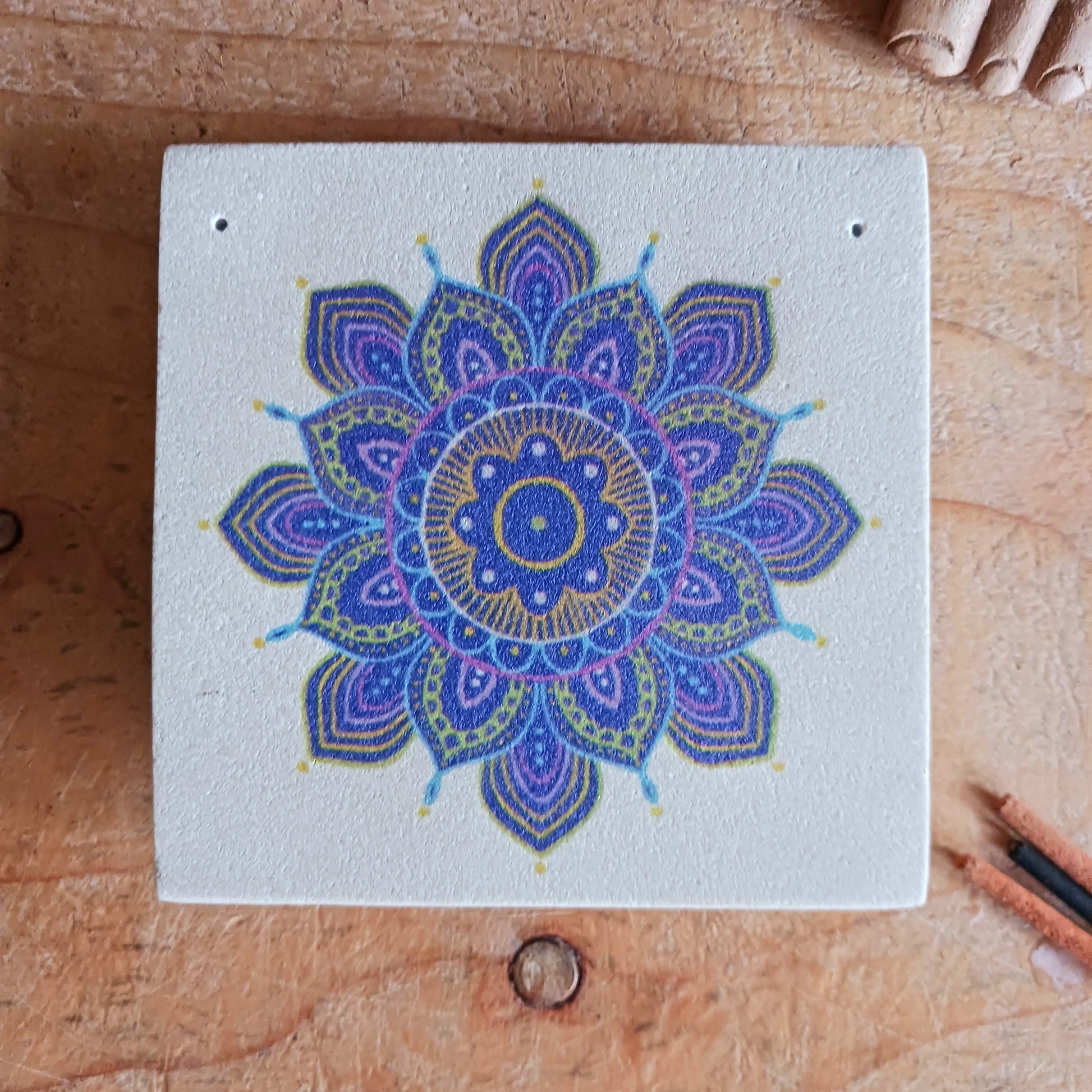 Bring tranquillity and artistic beauty into your space with this handcrafted sandstone incense burner, featuring a vibrant purple mandala print. The natural weight and texture of the sandstone ensure stability while burning your favourite incense, and the detailed mandala design adds a calming, spiritual touch to any room.