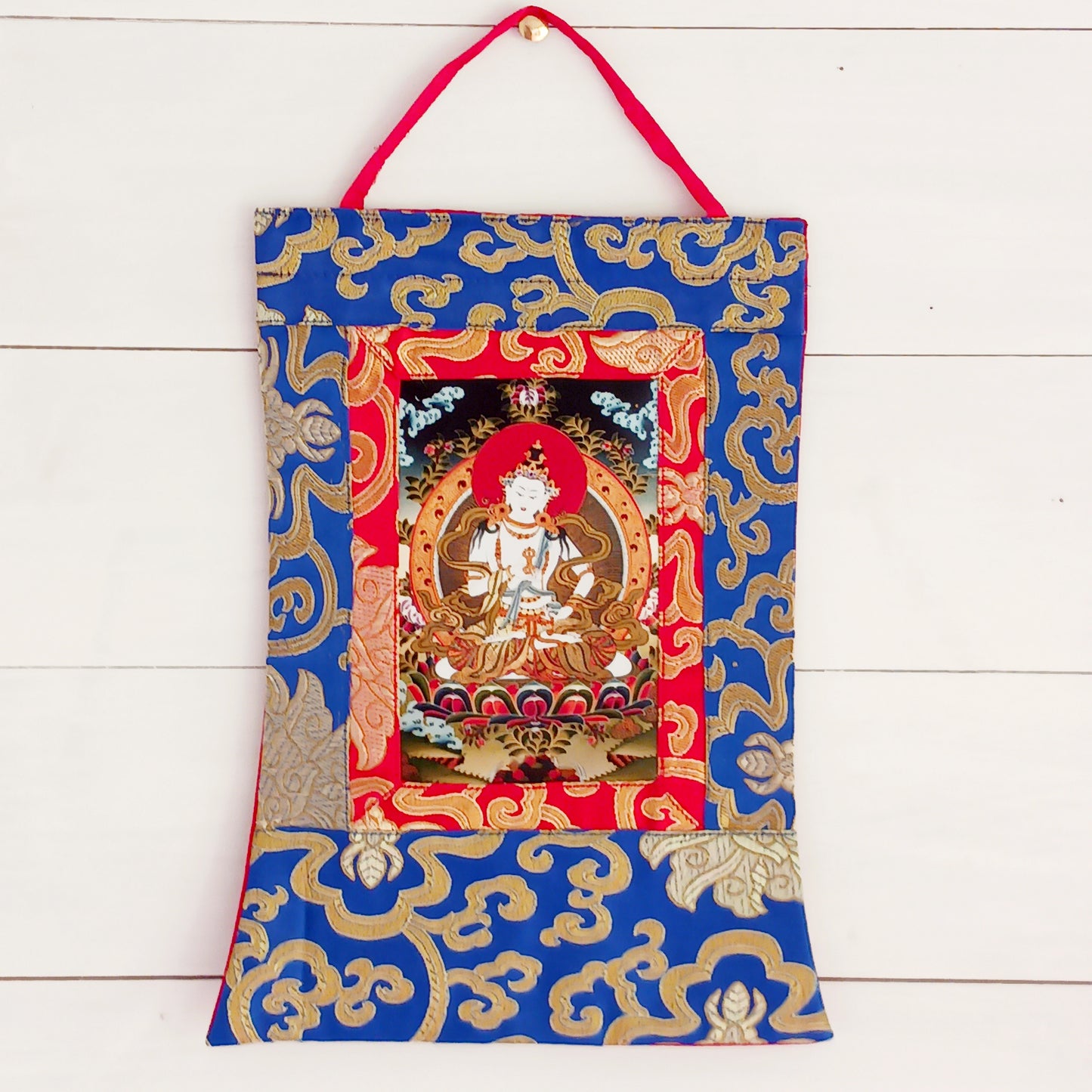 Small Vajrasattva thangka with silk brocade frame. A sacred symbol of purification in Tibetan Buddhism. Ideal for altars, gifts, or meditation practice.