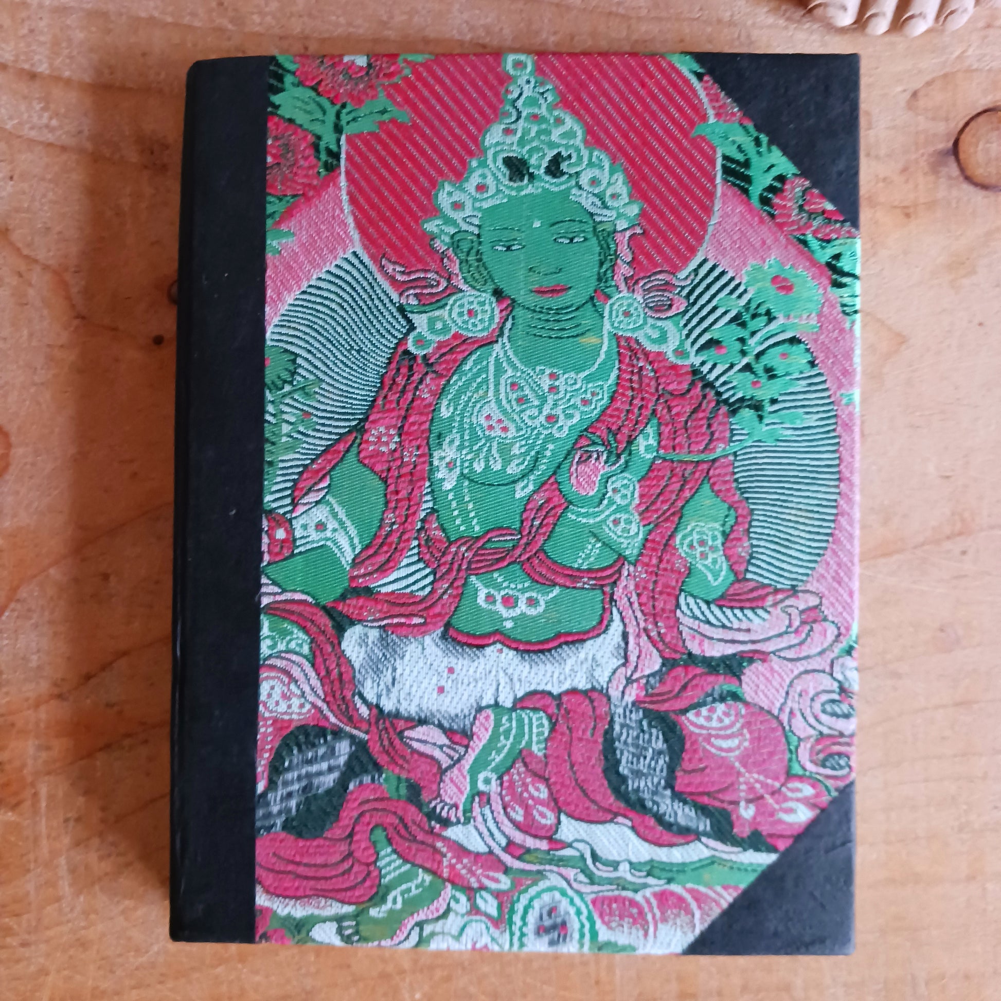 These brocade Green Tara Lokta Notebooks have been made using handmade Nepal paper and are bound with a cover of Brocade with Green Tara. They contain 50 pages made of "Lokta" paper and measure 6" x 8". The "Lokta" paper is made of Daphne Paper. It is hand made using a traditional method without involving any mechanical equipment, and no chemicals are used.