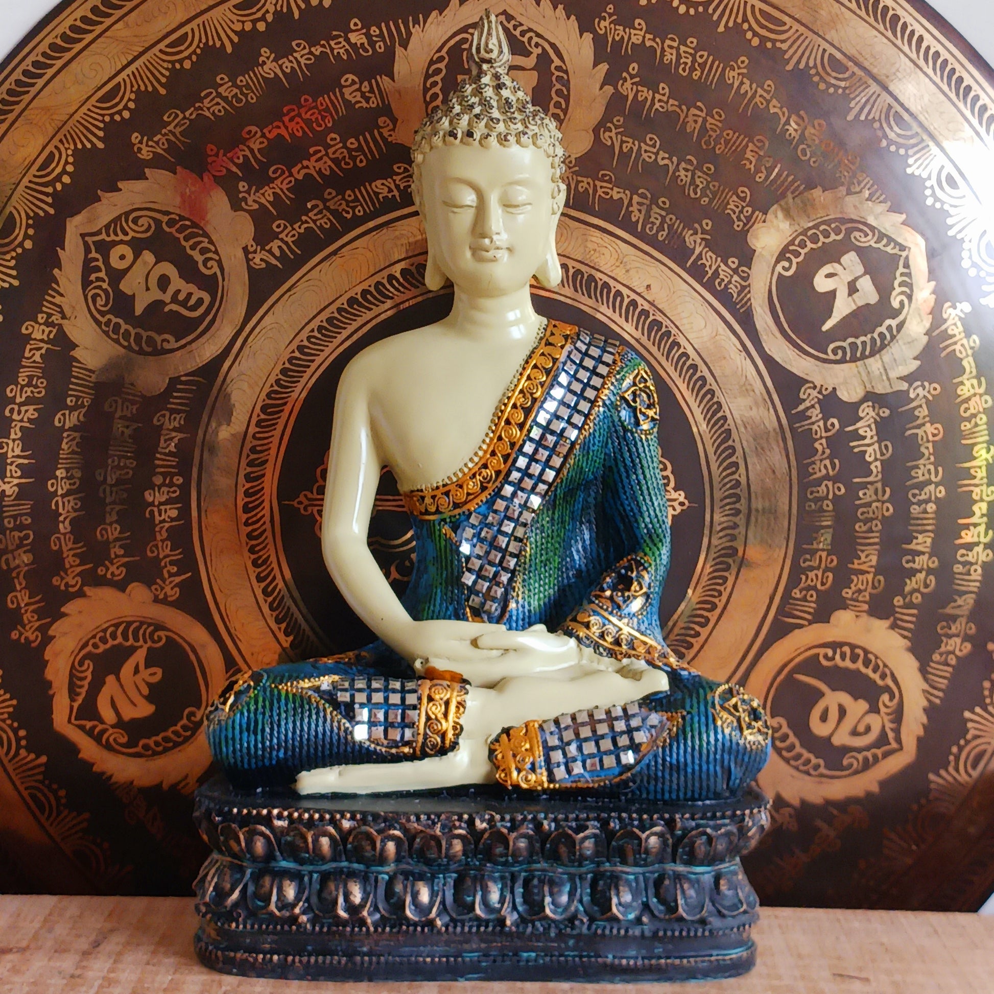 Bring serenity and elegance to your space with this meditating Thai-Style Buddha statue. Standing 29 cm tall, it is beautifully crafted from durable Poly Resin and features a shimmering Mirror inlay that reflects light and grace in every detail. Perfect for home decor, meditation spaces, or as a meaningful gift, this statue inspires peace and mindfulness wherever it's placed.
