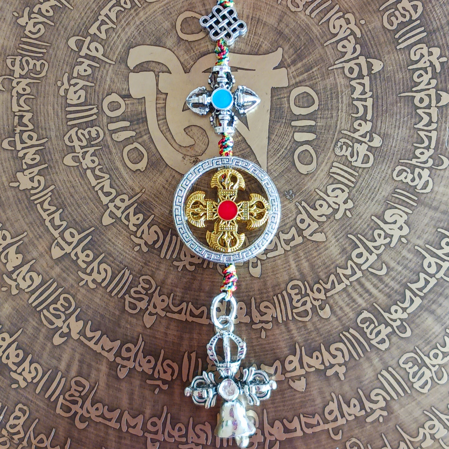 Bring peace, protection, and wisdom wherever you go with this handcrafted Buddhist protective pendant. Featuring the powerful Double Dorje, a symbol of stability and fearlessness, and the Bell, representing wisdom and the understanding of emptiness, this sacred charm is ideal for your car, home, bag, or key ring. Whether you're seeking spiritual grounding or a meaningful gift, this pendant serves as a constant reminder of balance and enlightenment in daily life.