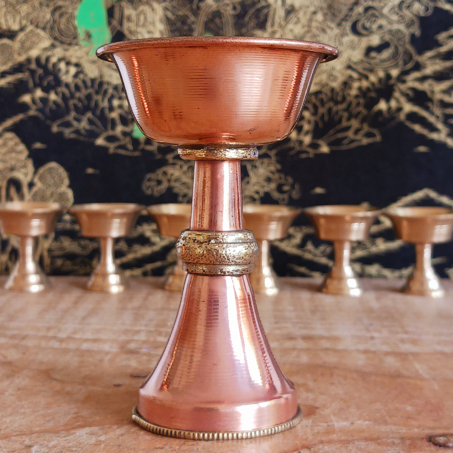 Illuminate your spiritual practice with this fine Traditional Tibetan Butter Lamp, handcrafted from high-quality copper.&nbsp;These sacred lamps are a central element in Tibetan Buddhist rituals, symbolizing the light of wisdom dispelling the darkness of ignorance. Commonly found in Himalayan temples and monasteries, butter lamps are offered each morning by Tibetan Buddhists.