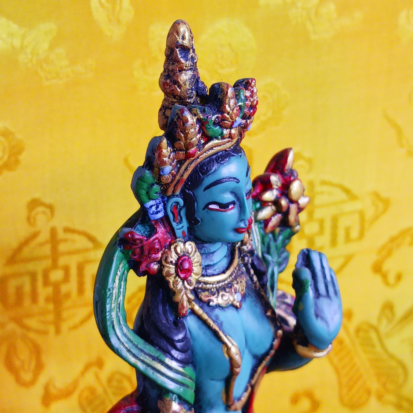 Bring sacred presence and compassionate energy into your space with this beautifully hand-painted resin statue of Green Tara, the revered bodhisattva of compassion and wisdom. One of the 21 manifestations of Tara, she is depicted here standing gracefully with her hands in the varada mudra, the gesture of generosity and blessing.