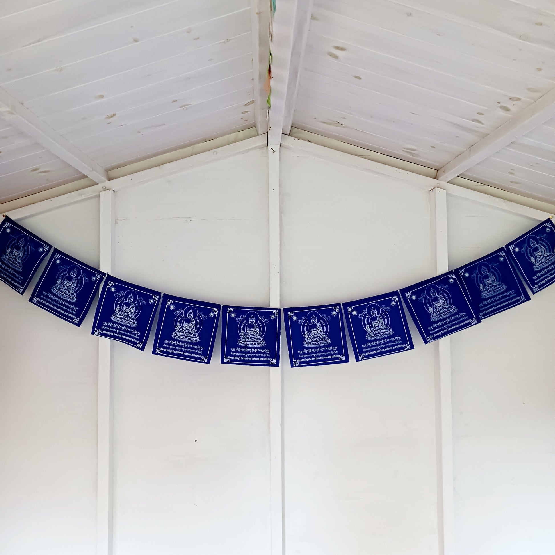 Hang these vibrant prayer flags in your space to invoke the blessings of Medicine Buddha and cultivate an atmosphere of healing and serenity. Outside, as the flags flutter in the wind, they carry the divine energy and healing vibrations, spreading their transformative power throughout your surroundings.