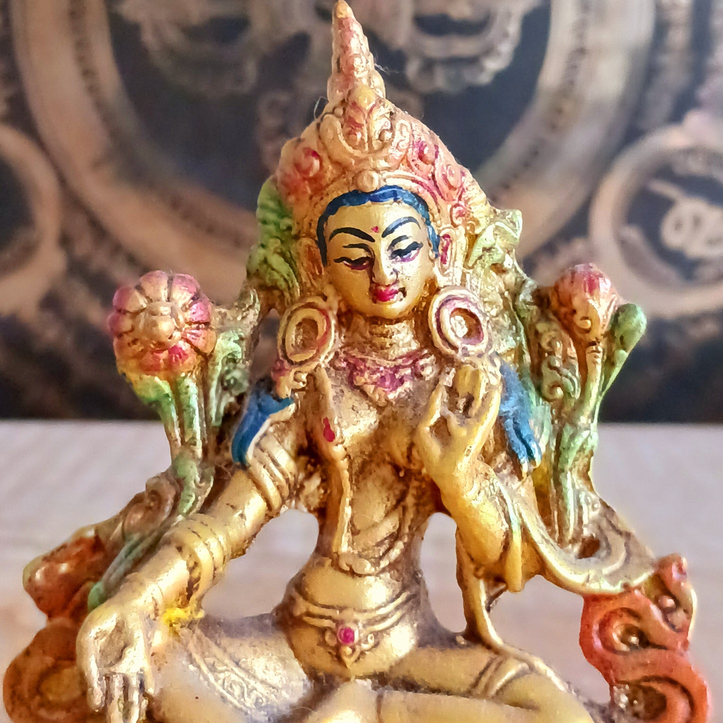 Bring peace, protection, and positive energy into your space with this exquisite Hand-Painted Gold Resin Green Tara Statue. 