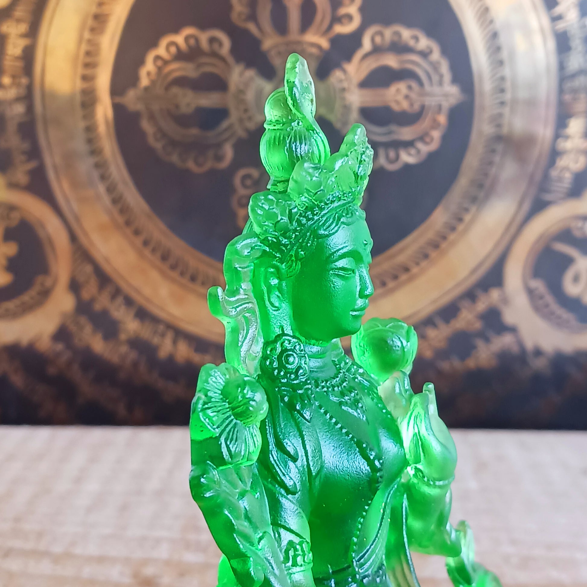 Bring serenity and divine feminine energy into your space with this stunning transparent Green Tara statue, crafted from high-quality glazed glass. Known as the "Mother of all Mothers," Green Tara represents compassion in action. Her graceful posture—one leg extended—symbolizes her readiness to help all beings instantly.