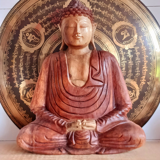 Bring a sense of peace, serenity and mindfulness into your home with this beautiful large Hand Carved Wooden Meditating Buddha Statue. Traditionally crafted in Bali from sustainable Suar wood, each statue is a unique work of art, showcasing the natural beauty of the wood and the skill of the artisan.