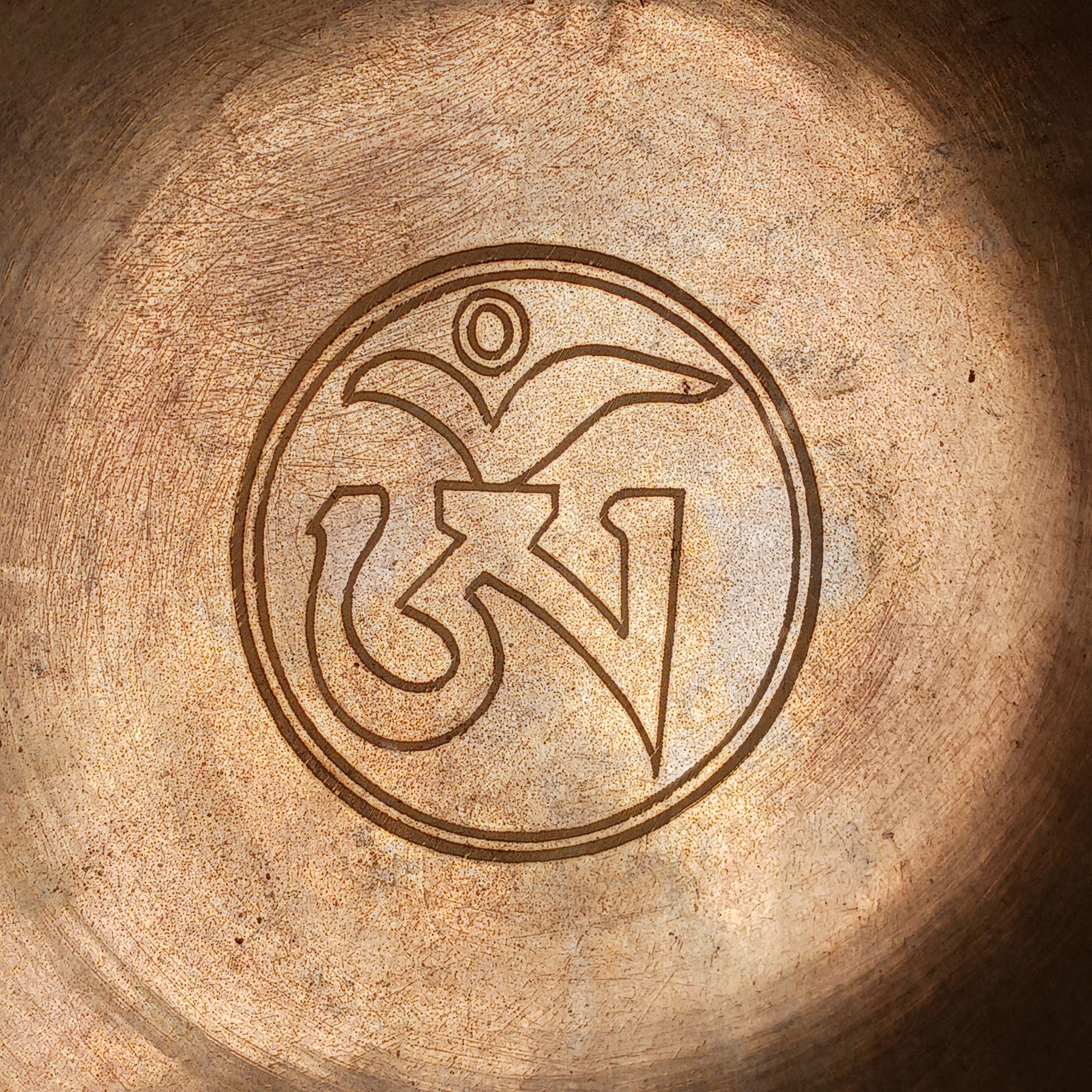 Elevate your meditation and sound healing practice with this Classic Hand-Hammered Singing Bowl, beautifully engraved with the sacred OHM symbol inside the bowl. This is a unique, one-of-a-kind item—you will receive exactly the bowl pictured.