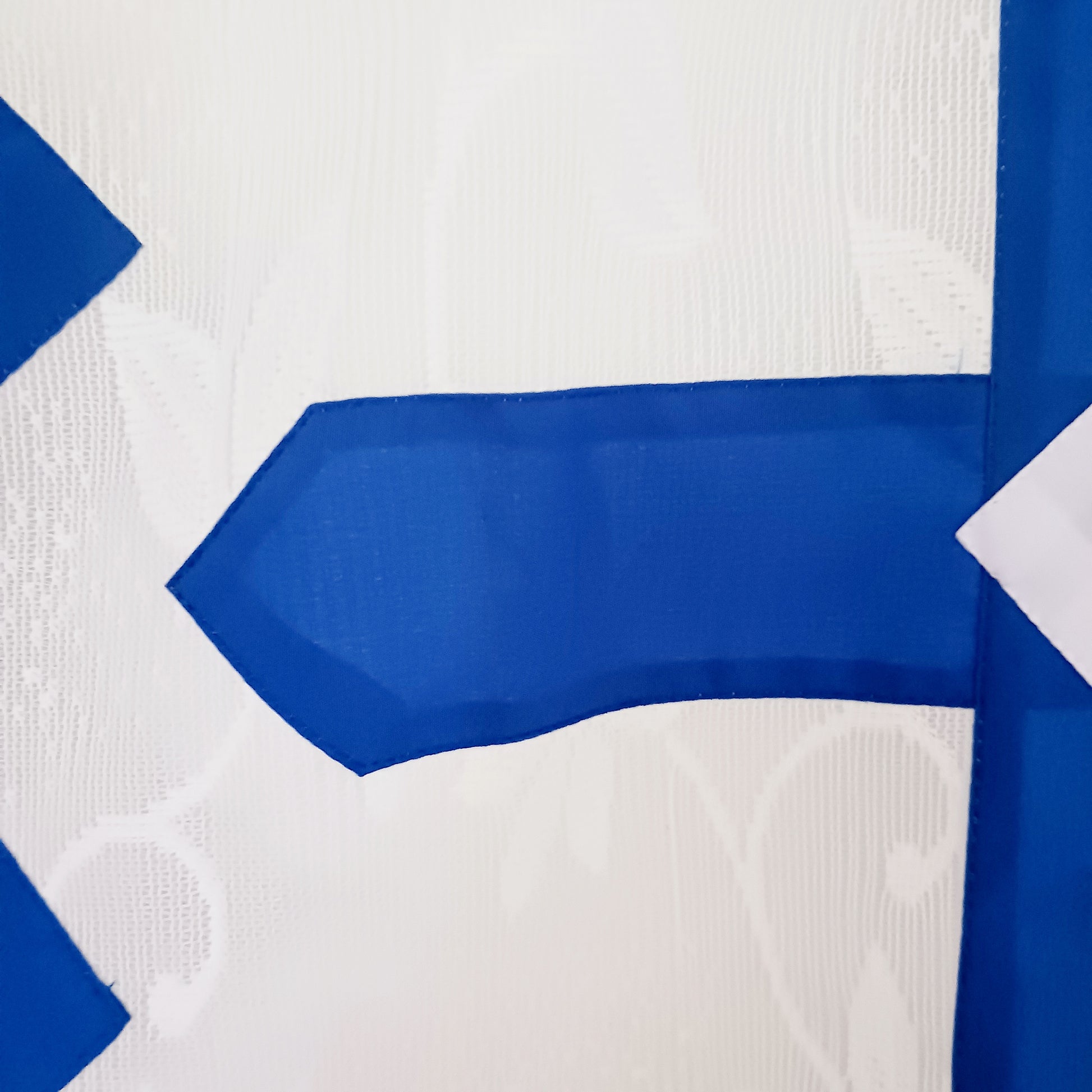 Bring spiritual harmony and traditional Himalayan craftsmanship into your home with this handmade Tibetan Buddhist Endless Knot Door Curtain. Crafted in a white fabric, this semi-transparent curtain allows natural light to pass through, creating a warm and calming atmosphere.