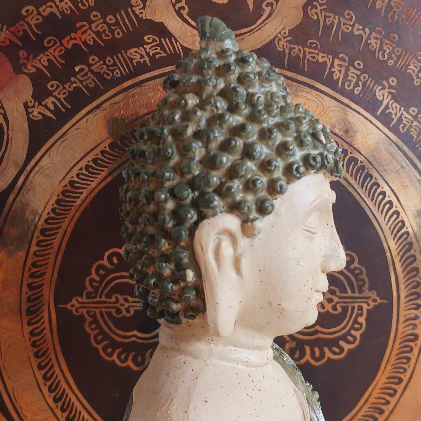 Invite peace and mindfulness into your space with this Buddha statuette, featuring a calming green mosaic pattern. Seated in the classic meditation pose with a tranquil expression, this modest figure is perfect for a shelf, home altar, or personal meditation corner. 