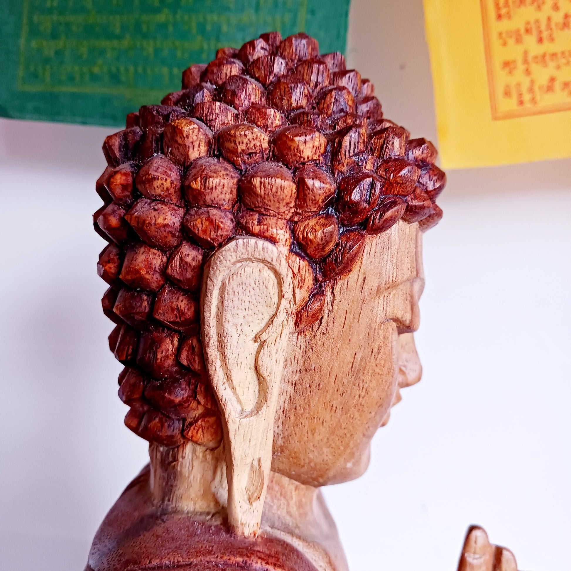Bring calm, wisdom, and mindful intention into your space with this beautifully serene Teaching Buddha statue, hand-carved from sustainable Suar wood (Albizia Saman), a fast-growing and responsibly cultivated hardwood.