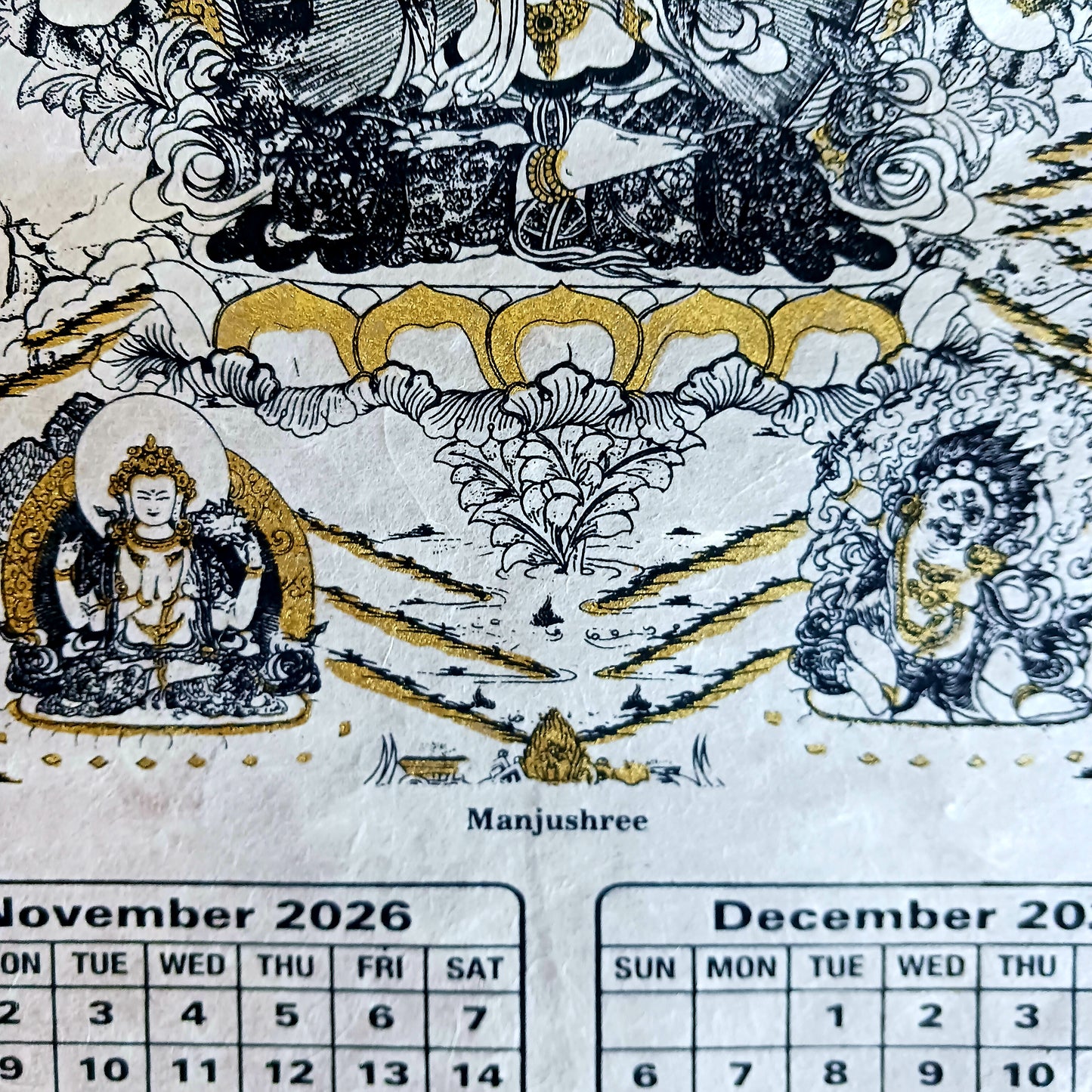 Bring the beauty, wisdom, and serenity of Buddhist art into your home with this handmade Lokta paper wall calendar, featuring seven revered Buddhist deities illustrated in traditional Thangka style. Each page showcases one of the following sacred figures:
