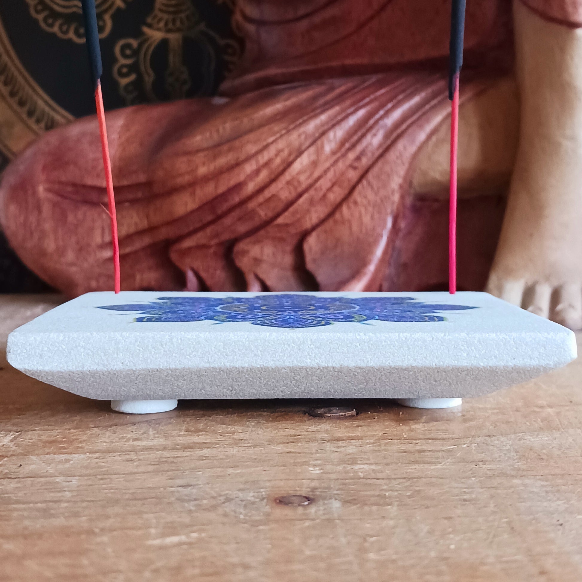 Bring tranquillity and artistic beauty into your space with this handcrafted sandstone incense burner, featuring a vibrant purple mandala print. The natural weight and texture of the sandstone ensure stability while burning your favourite incense, and the detailed mandala design adds a calming, spiritual touch to any room.