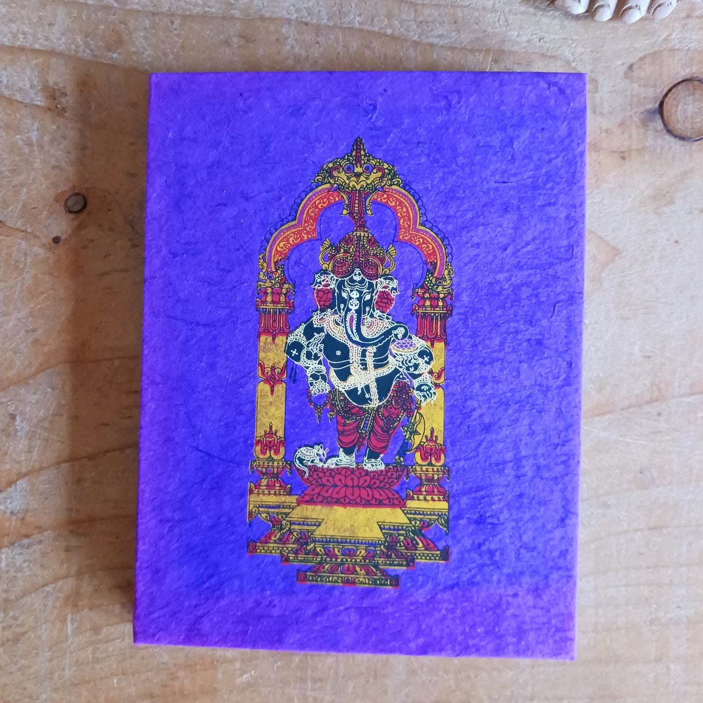 Bring meaning, colour, and craftsmanship to your writing with this beautifully handcrafted Lokta paper notebook. Each book features a vibrant, intricately decorated cover showcasing Lord Ganesh, symbolising wisdom, prosperity, and new beginnings.