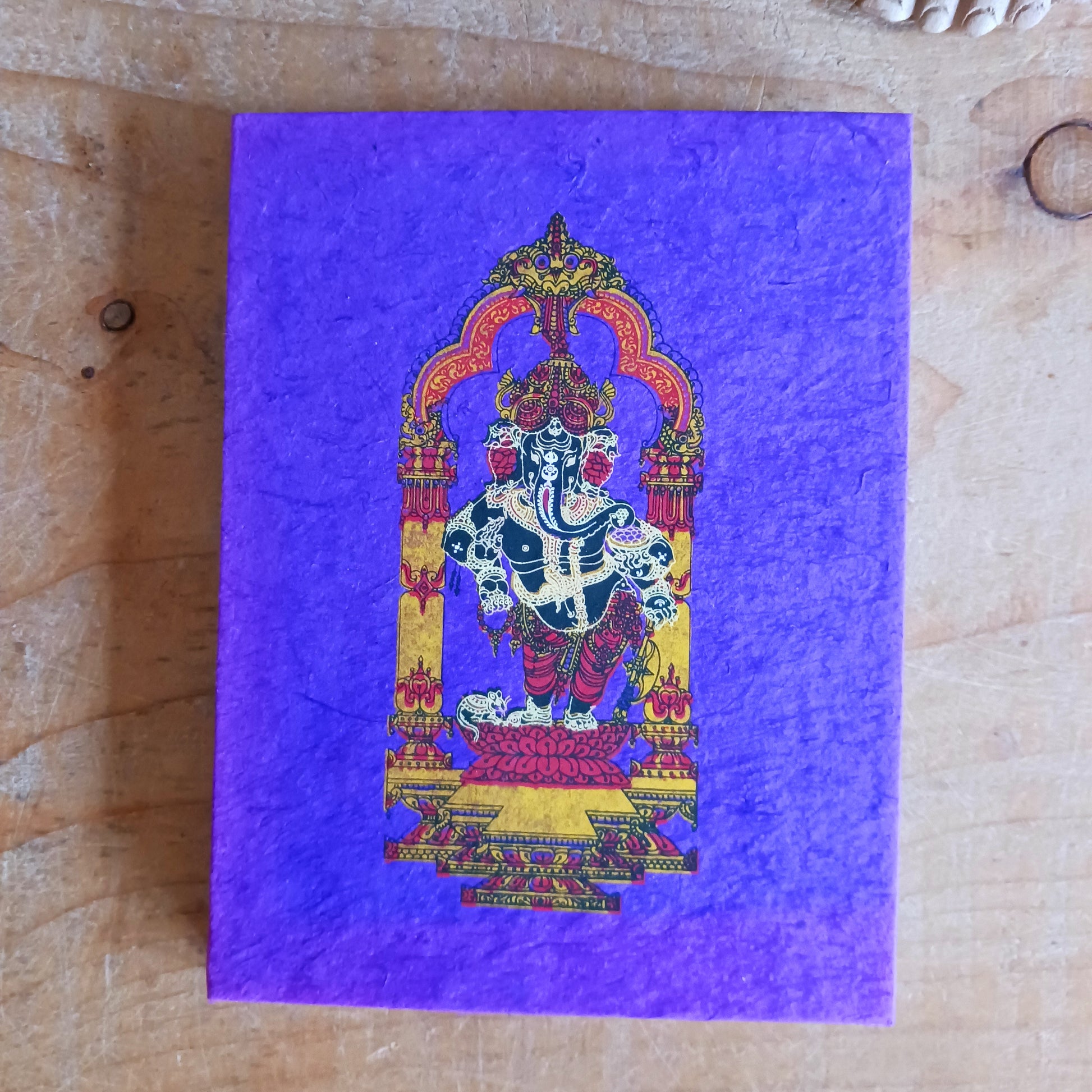 Bring meaning, colour, and craftsmanship to your writing with this beautifully handcrafted Lokta paper notebook. Each book features a vibrant, intricately decorated cover showcasing Lord Ganesh, symbolising wisdom, prosperity, and new beginnings.