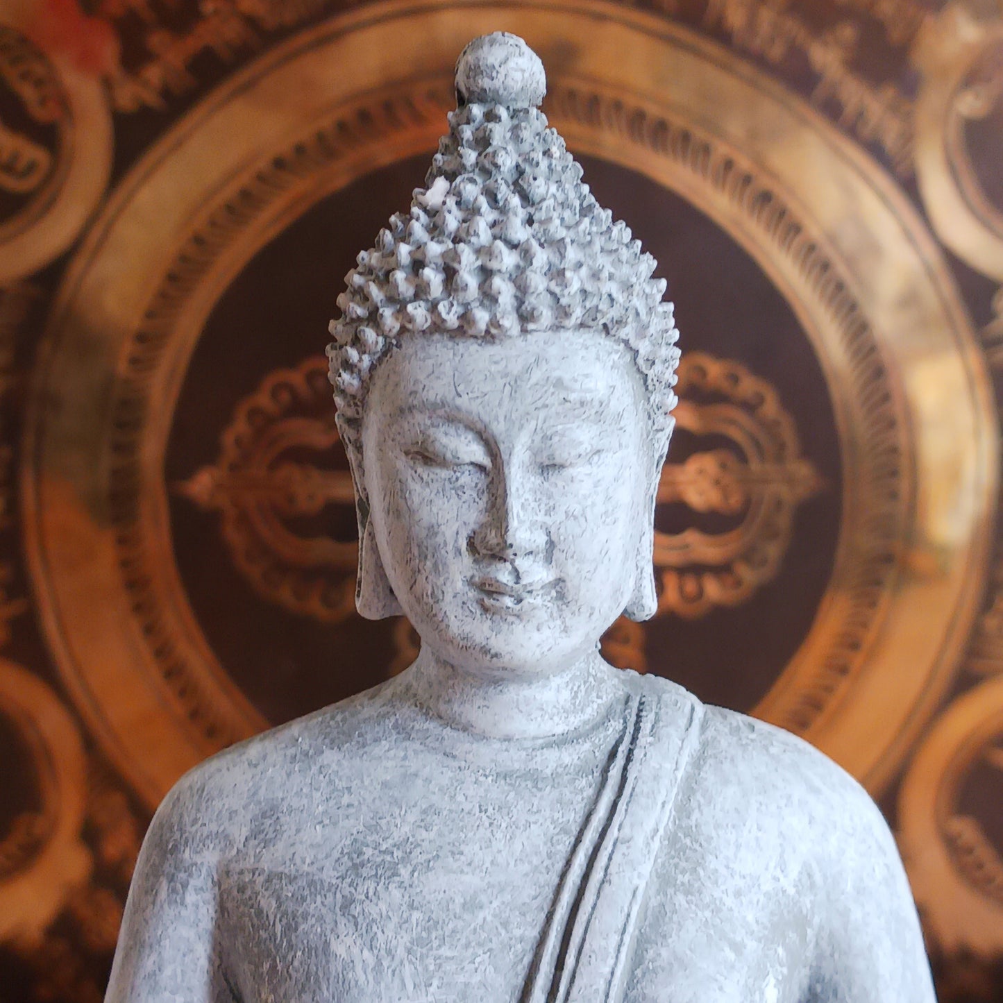 Invite peace and mindfulness into your space with this serene grey Thai-style Buddha statue. Crafted to reflect traditional Thai artistry, this elegant piece features a meditating Buddha seated gracefully on a throne. The calm expression and intricate detailing make it a perfect centerpiece for your home, meditation area, or spiritual altar. Ideal for anyone seeking a touch of tranquility and spiritual inspiration in their décor.