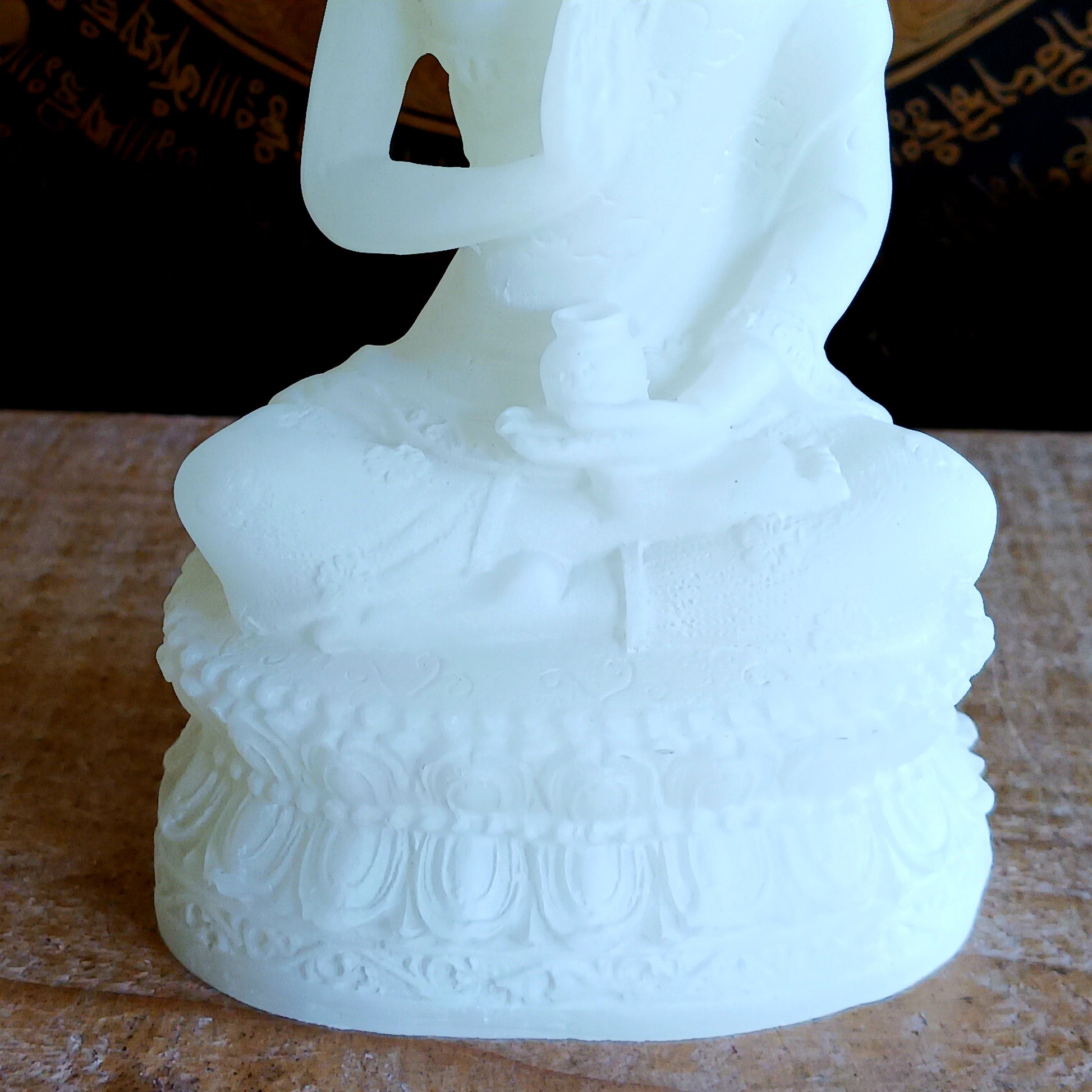 Bring serenity and spiritual symbolism into your sacred space with this beautifully crafted 16cm White Buddha Statue, complete with an Amrita vase. Handmade in Tibet, this statue reflects traditional Buddhist artistry and carries deep meaning rooted in ancient Sanskrit.
