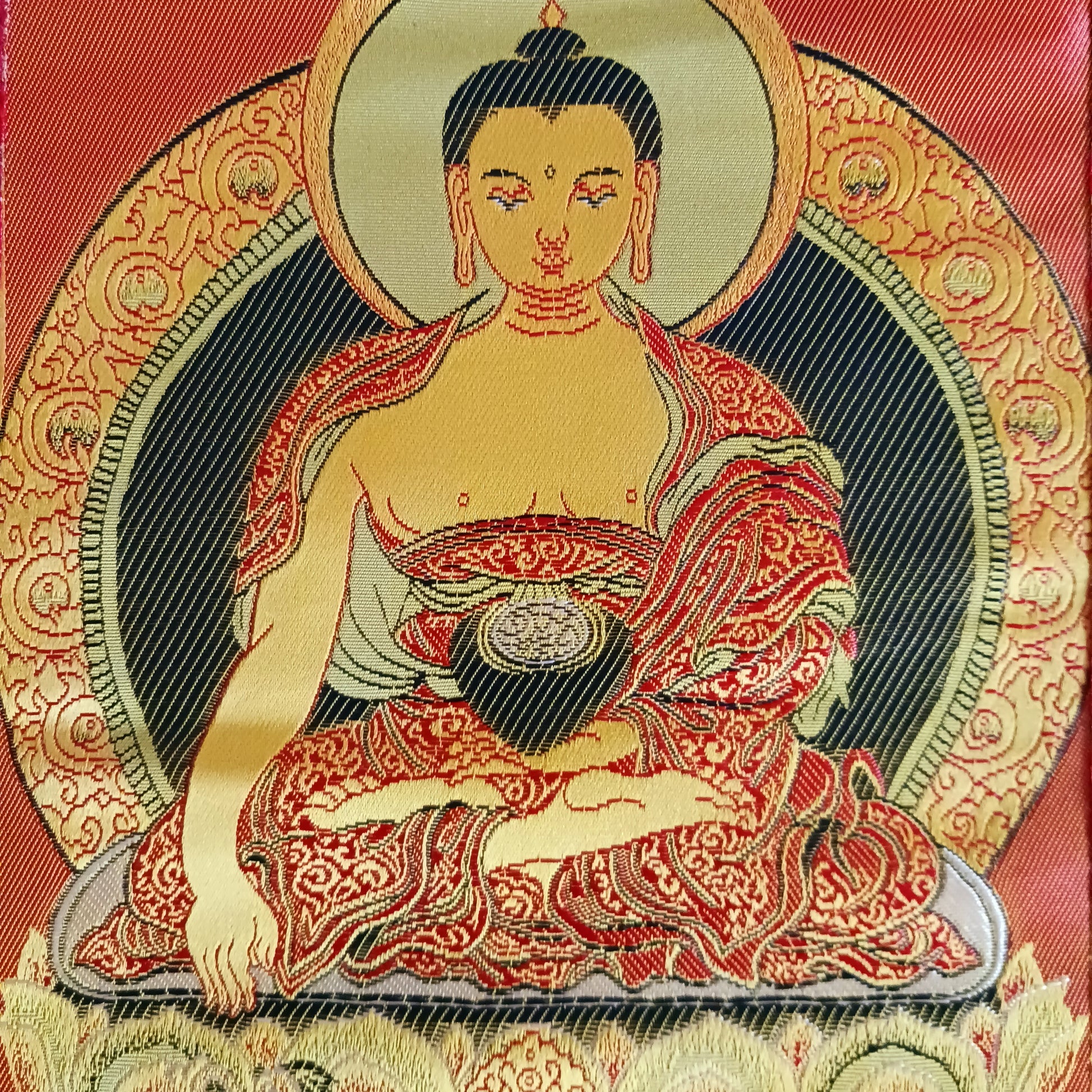 Bring serenity, beauty, and spiritual inspiration into any space with this Handmade Embroidered Buddha Thangka, crafted by skilled artisans in Nepal. Each piece is created using traditional techniques passed down through generations, featuring intricate embroidery and a rich brocade border that highlights the calm and compassionate presence of the Buddha.