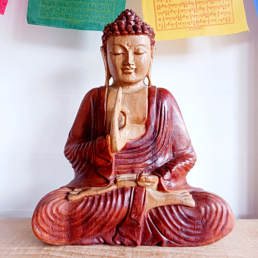 Bring calm, wisdom, and mindful intention into your space with this beautifully serene Teaching Buddha statue, hand-carved from sustainable Suar wood (Albizia Saman), a fast-growing and responsibly cultivated hardwood.