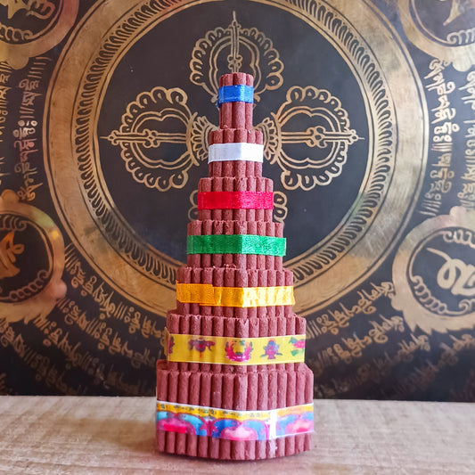 Bring authentic Himalayan tradition to your sacred space with this Buddhist Shrine Tibetan Incense Torma. Handmade in Nepal using the ancient art of incense crafting, each torma is carefully formed from a blend of herbs, fragrant woods, and spices.