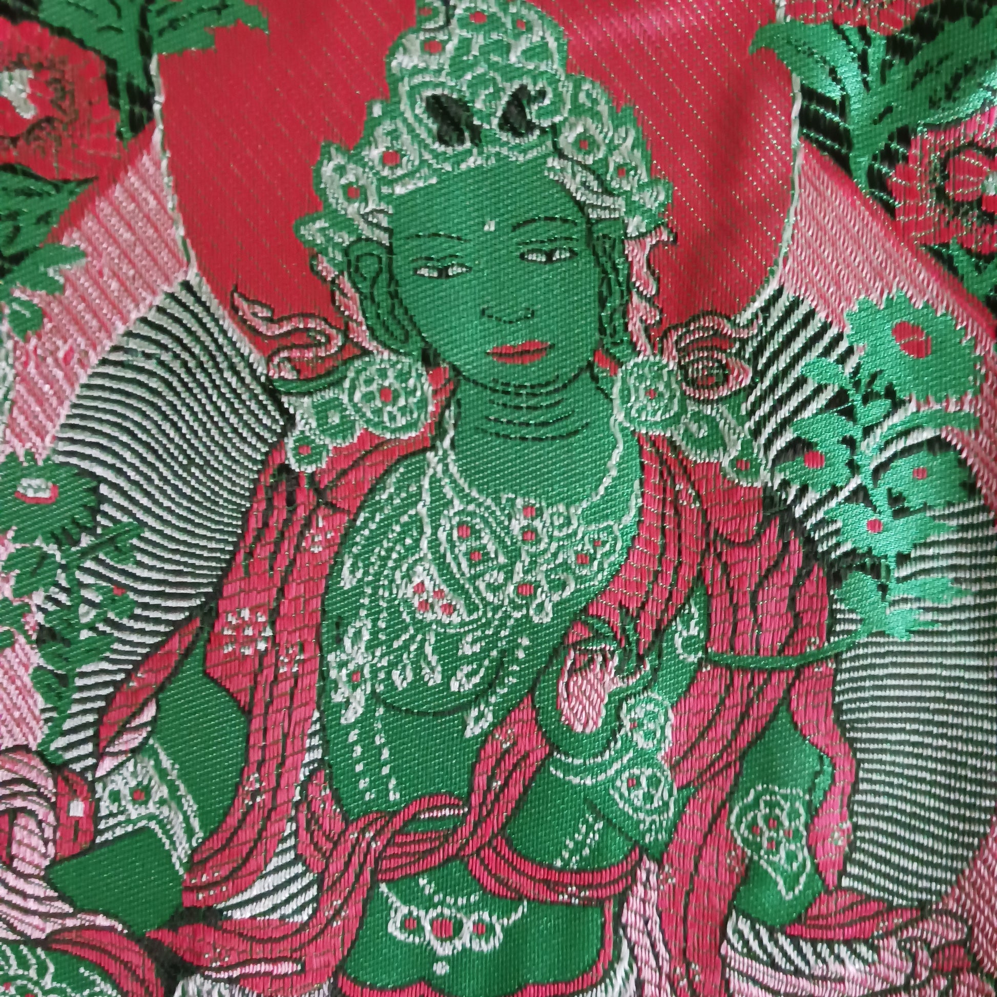 Bring serenity, beauty, and spiritual inspiration into any space with this Handmade Embroidered Green Tara Thangka, crafted by skilled artisans in Nepal. Each piece is created using traditional techniques passed down through generations, featuring intricate embroidery and a rich brocade border that highlights the calm and compassionate presence of Green Tara.