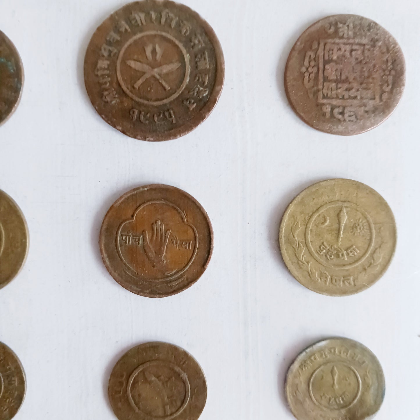 Explore the rich numismatic heritage of Nepal with this curated collection of vintage coins from the reign of King Tribhuvan Bir Bikram Shah Dev (1911–1955 AD). Each coin is a tangible piece of history, reflecting a transformative era that shaped modern Nepal.