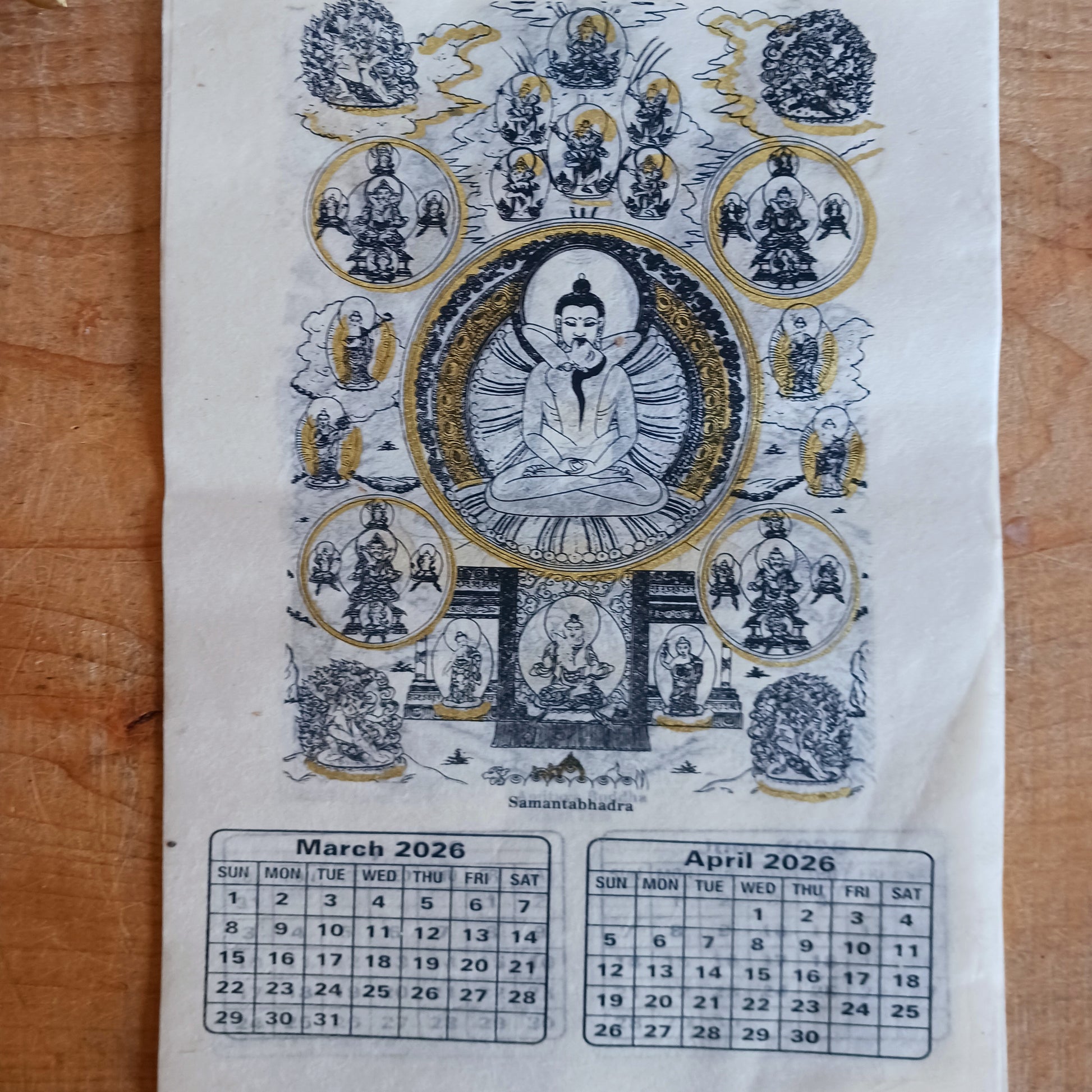Bring the beauty, wisdom, and serenity of Buddhist art into your home with this handmade Lokta paper wall calendar, featuring seven revered Buddhist deities illustrated in traditional Thangka style. Each page showcases one of the following sacred figures: