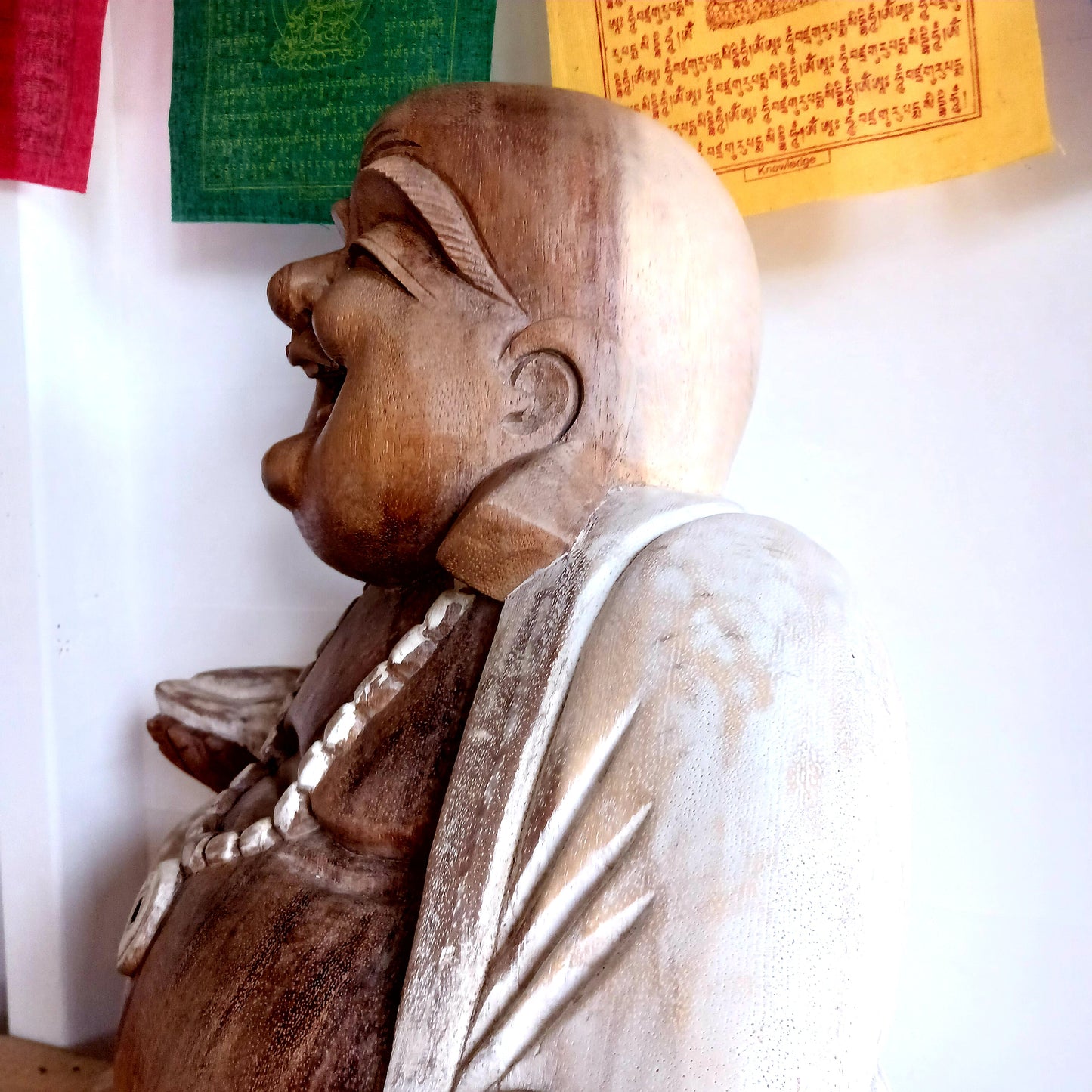 Bring warmth, joy, and calm into your space with this stunning Large Hand-Carved Happy Buddha Statue. Each piece is patiently sculpted by skilled artisans using traditional tools, a process that can take weeks and gives every curve and detail its distinctive character.