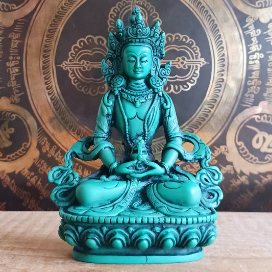 White Tara is known for compassion, long life, healing and serenity and is shown here with her right hand in the varada mudra (blessing pose.) White Tara is distinct from the more commonly seen Green Tara. She is seated in a tranquil, full lotus position as opposed to Green Tara's one foot extended pose. These intricate resin statues are carefully handcrafted in Nepal.