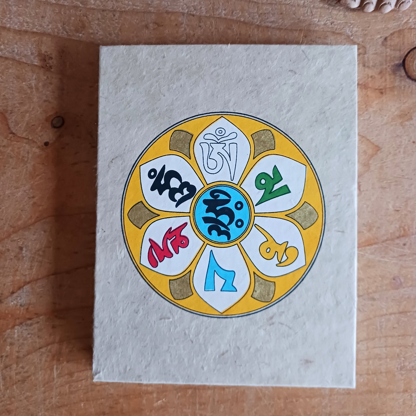 Discover the beauty of traditional craftsmanship with our Handmade Om Mani Notebooks. Each notebook features a durable hard-back cotton cover adorned with the sacred Om Mani design, symbolising wisdom and compassion.