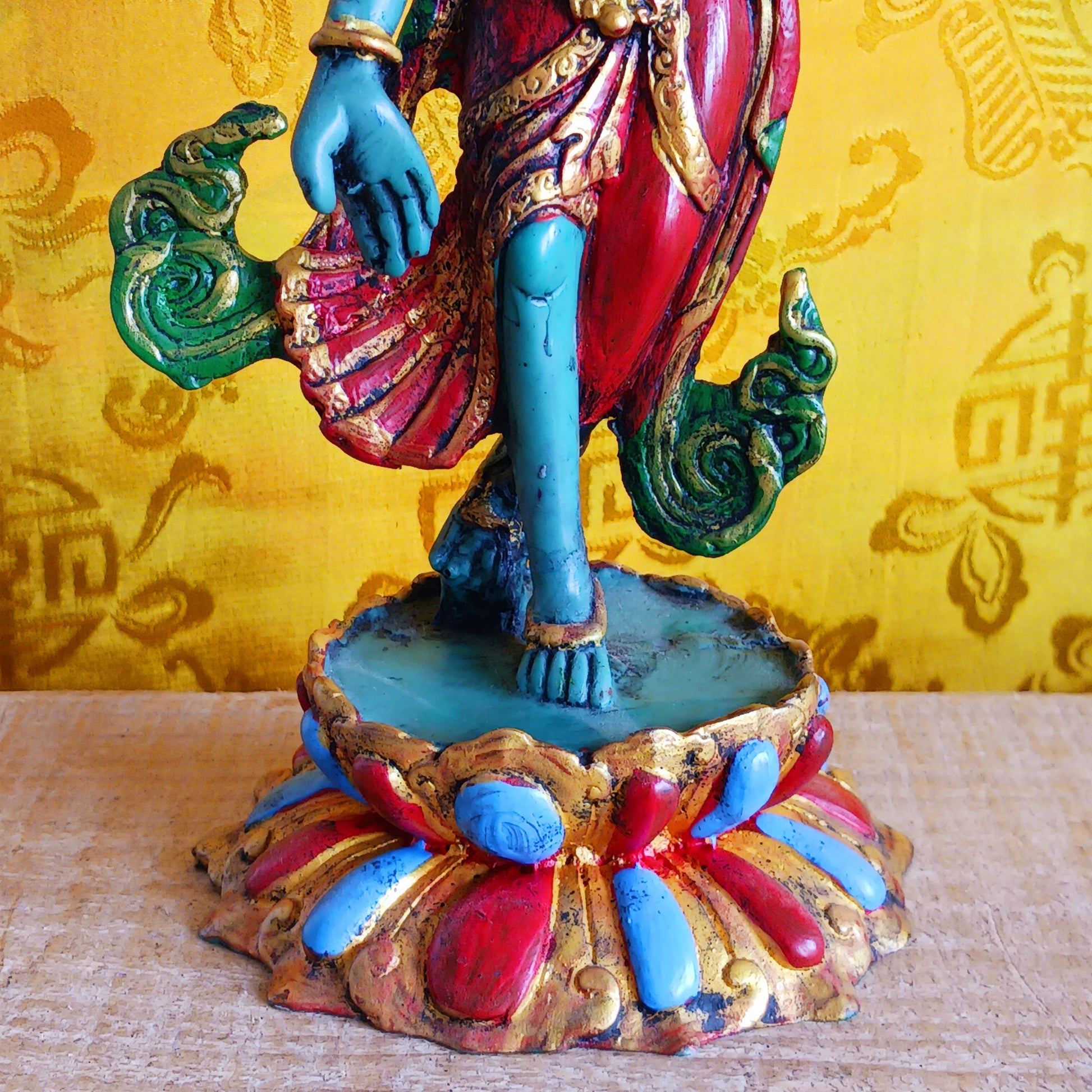 Bring sacred presence and compassionate energy into your space with this beautifully hand-painted resin statue of Green Tara, the revered bodhisattva of compassion and wisdom. One of the 21 manifestations of Tara, she is depicted here standing gracefully with her hands in the varada mudra, the gesture of generosity and blessing.