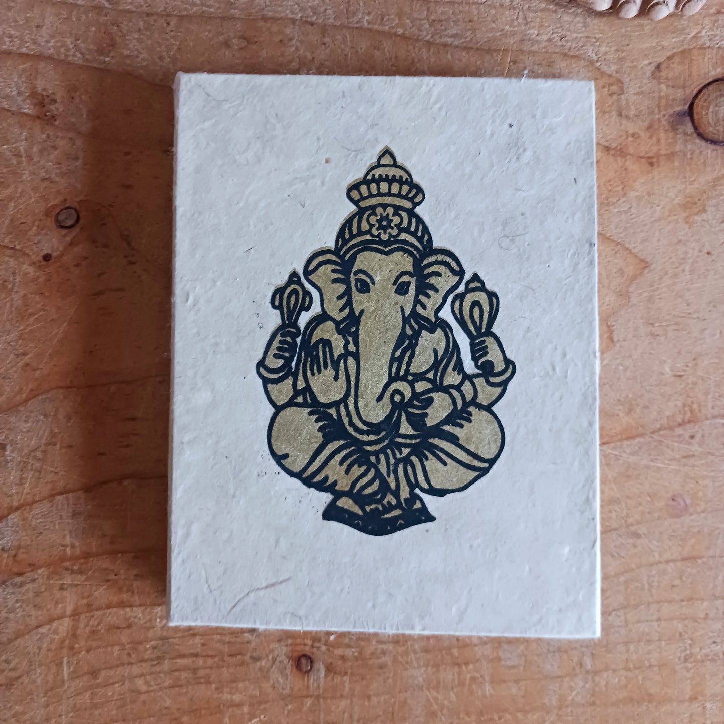 Bring meaning, and craftsmanship to your writing with this beautifully natural handcrafted Lokta paper notebook. Each book features a vibrant, intricately decorated cover showcasing Lord Ganesh, symbolising wisdom, prosperity, and new beginnings.
