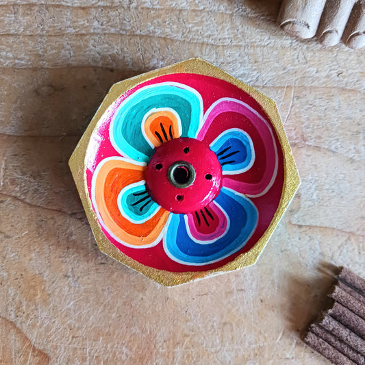 A beautiful little handcrafted Tibetan Incense stick holder, Hand painted and ethically sourced this incense holder is perfect for the larger Tibetan incense and also has 4 small holes for Indian sticks.