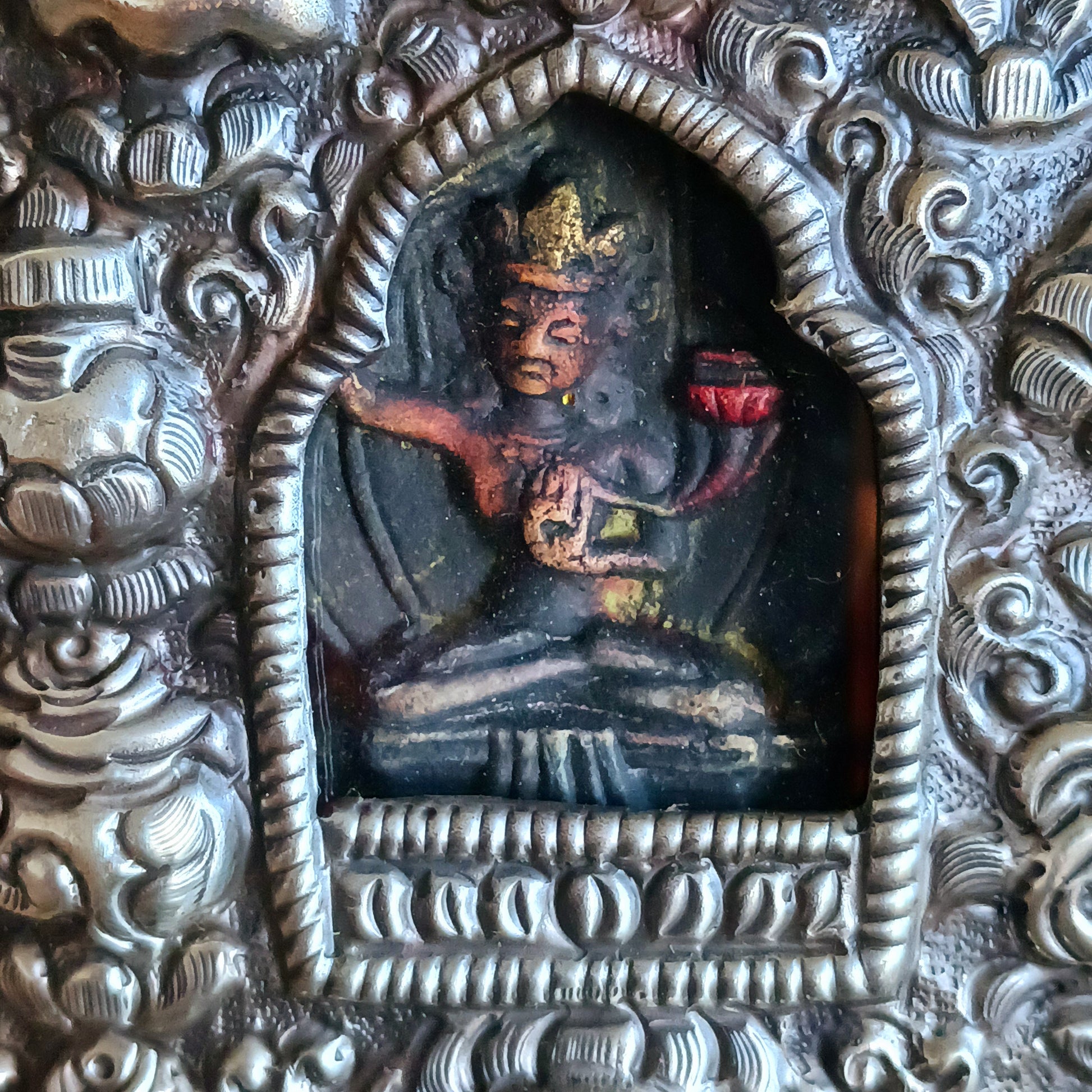 Discover the spiritual power of the Tibetan Ghau, a portable shrine and traditional prayer box used to carry sacred relics, charms, and medicinal herbs. Crafted by skilled Tibetan refugee artisans in Nepal, each Ghau serves as a portable shrine offering protection and blessings during travel. Wear it as a pendant around your neck or hang it from a waist sash or belt. This handcrafted piece is not only a spiritual talisman but also a beautiful work of art, connecting you to centuries-old Tibetan traditions.