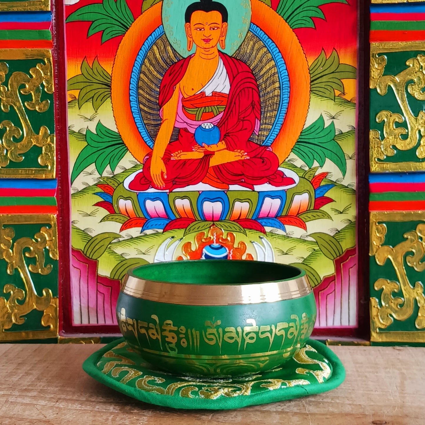 Hand-painted Green Tara singing bowl set with striker & pillow. A sacred gift for meditation, mindfulness, or yoga. Comes in eco-friendly packaging.