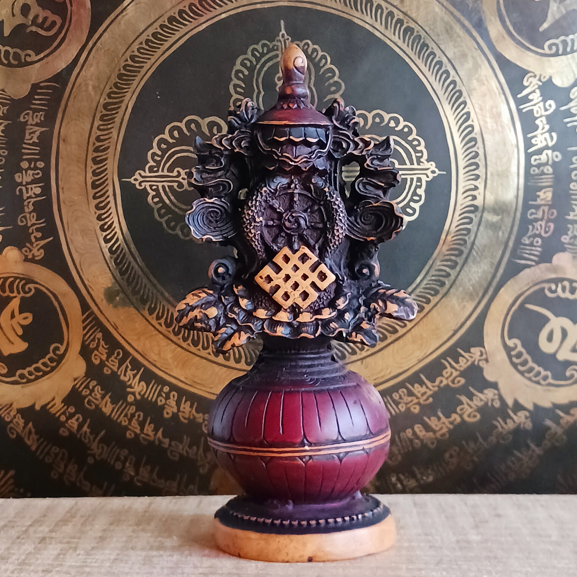 Invite harmony, abundance, and spiritual protection into your space with this hand-finished Tibetan Treasure Vase. Traditionally revered in Tibetan Buddhism, the Treasure Vase represents health, longevity, wealth, prosperity, wisdom, and the vast potential of space.