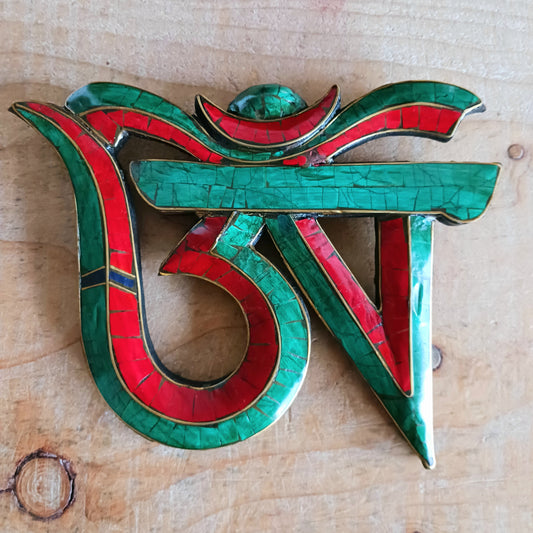Bring harmony, artistry, and spiritual presence into your space with this handmade wooden Tibetan OM sign, inspired by the first character of the sacred mantra “Om Mani Padme Hum.”