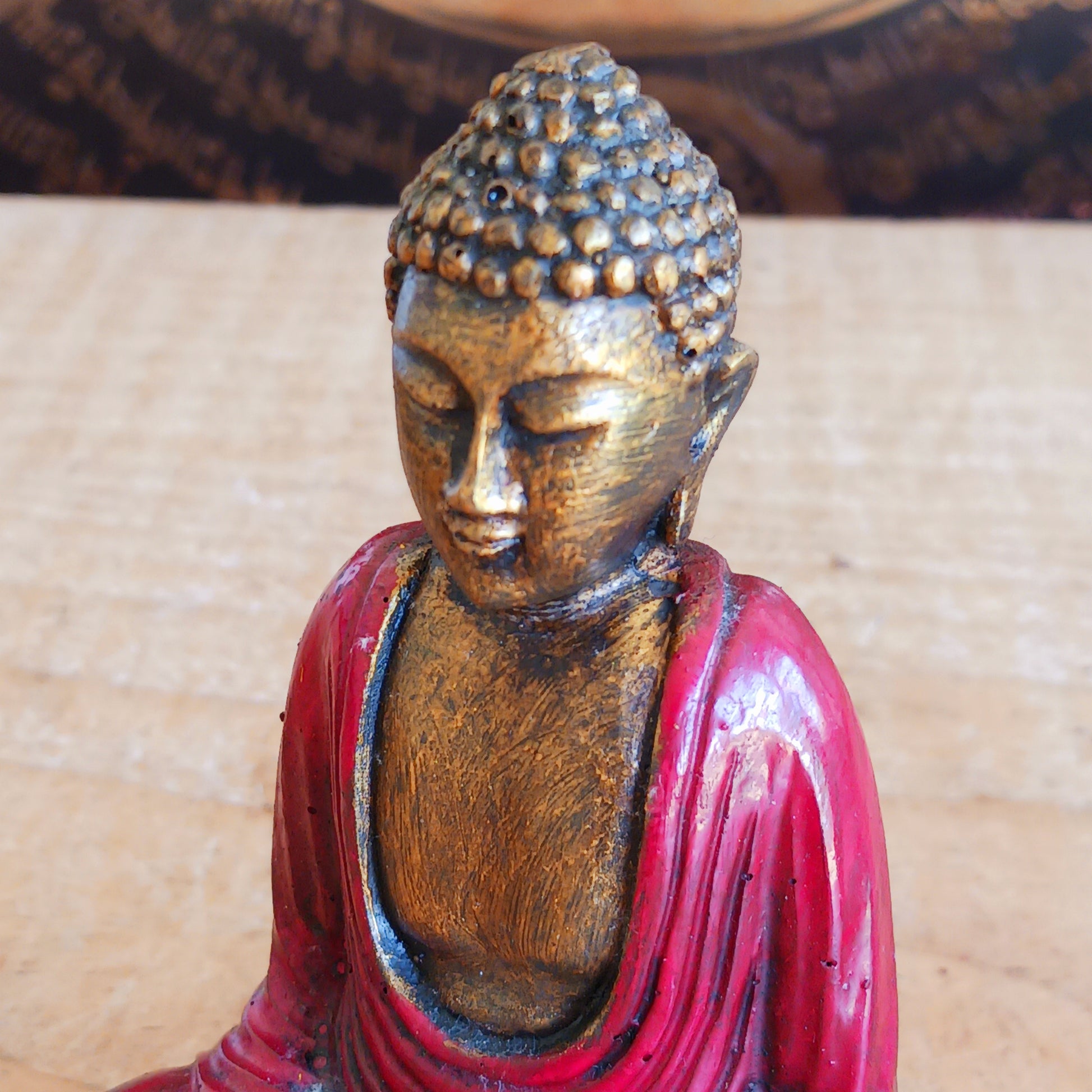 Create a calming and uplifting atmosphere with this beautiful little Red & Gold Buddha Statue. Designed to inspire peace, harmony, and positive energy, this charming decorative ornament makes a wonderful addition to any home, office, meditation room, or yoga space.