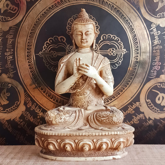 Bring serenity and wisdom into your space with this large, intricately detailed Buddha statue. Cast in a deep sand colour, this statue depicts the Buddha in the Dharmachakra Mudra — the "Wheel of Dharma" gesture. 