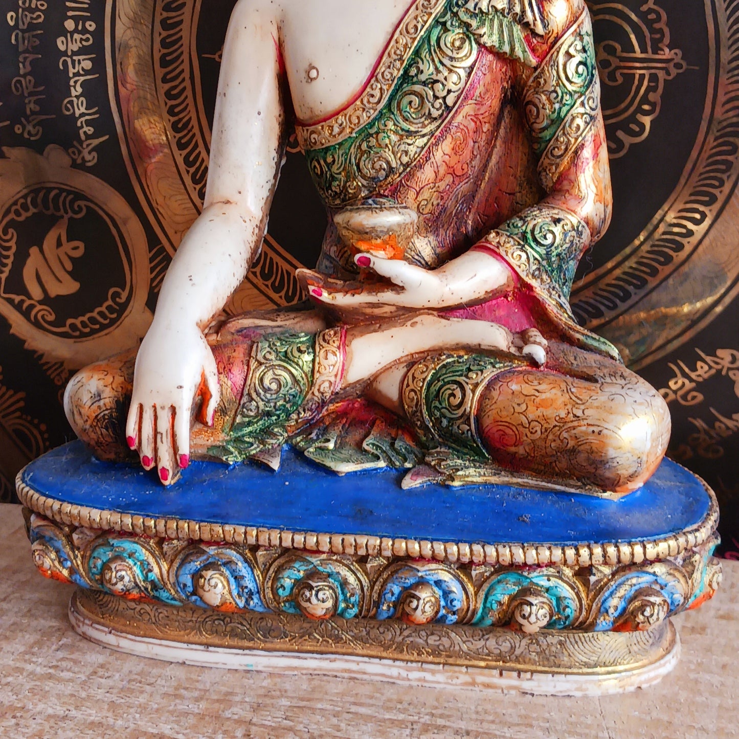 This exquisite Shakyamuni Buddha statue is crafted from a blend of clay and resin, then hand-painted by skilled artisans in Nepal. Using traditional thangka colours, each piece is meticulously detailed to match the authentic representations of Shakyamuni Buddha. The traditional painting process reflects deep spiritual symbolism, making this statue not only a beautiful decorative item but also a meaningful spiritual artifact. Perfect for your altar, meditation space, or as a unique cultural gift.