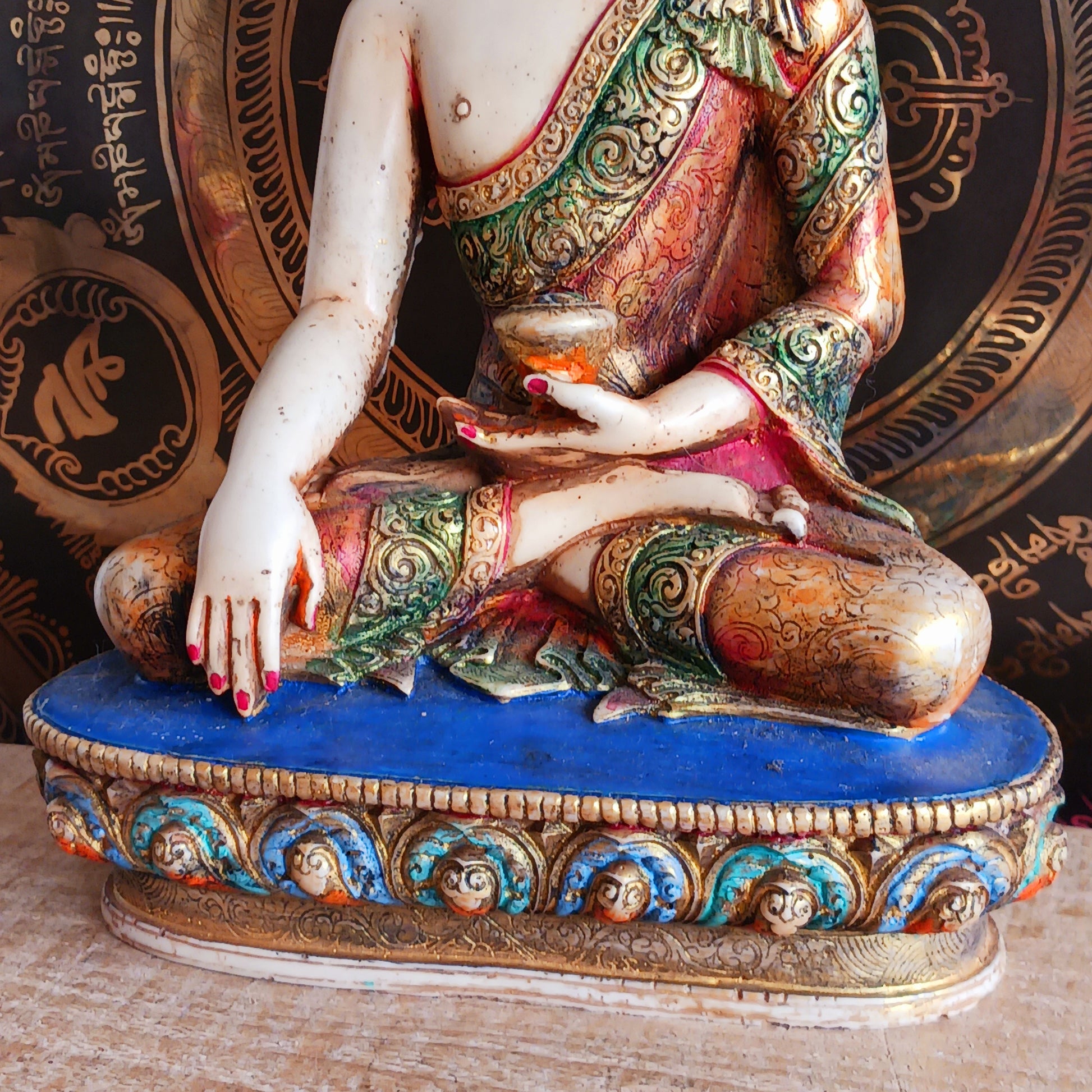 This exquisite Shakyamuni Buddha statue is crafted from a blend of clay and resin, then hand-painted by skilled artisans in Nepal. Using traditional thangka colours, each piece is meticulously detailed to match the authentic representations of Shakyamuni Buddha. The traditional painting process reflects deep spiritual symbolism, making this statue not only a beautiful decorative item but also a meaningful spiritual artifact. Perfect for your altar, meditation space, or as a unique cultural gift.