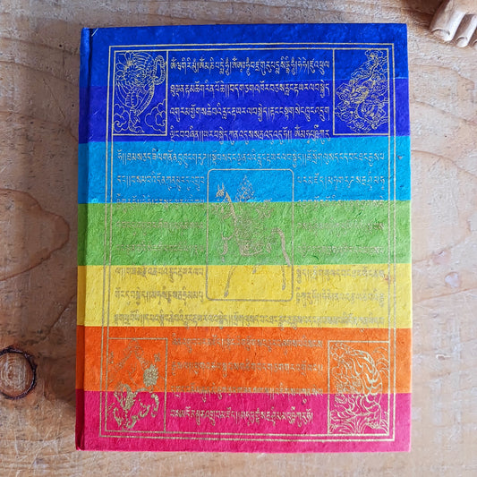 Embrace mindful creativity with this beautiful handmade Lokta notebook, featuring a soft cover adorned with a vibrant Prayer Flags print—a symbol of peace, compassion, and positive energy. Each notebook is crafted from natural, treeless Lokta paper, a sustainable material traditionally made in the Himalayas.