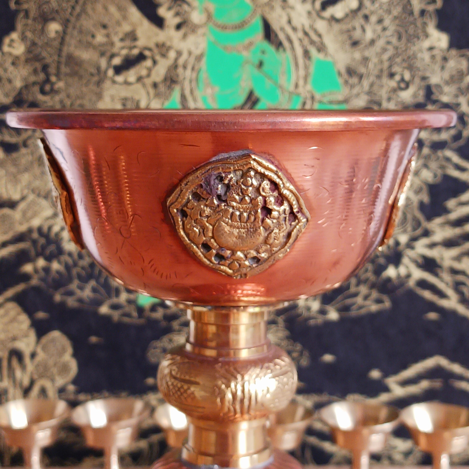 Illuminate your sacred space with this Large Copper Butter Lamp, beautifully handcrafted and engraved with traditional Tibetan auspicious symbols around the sides. Commonly used in Tibetan temples, these lamps are filled with yak butter, vegetable oil, or ghee and offered as a light to symbolize wisdom and clarity. Each morning, Tibetan Buddhists light butter lamps as a spiritual act of devotion and illumination. Perfect for altars, meditation spaces, or as a unique cultural centerpiece, this lamp brings bo