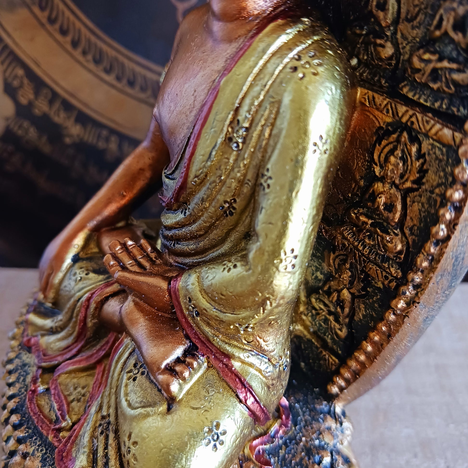 This finely detailed statue depicts the Historical Buddha Shakyamuni in the revered Bhumisparsha Mudra, the iconic earth-touching hand gesture symbolizing the moment of enlightenment.