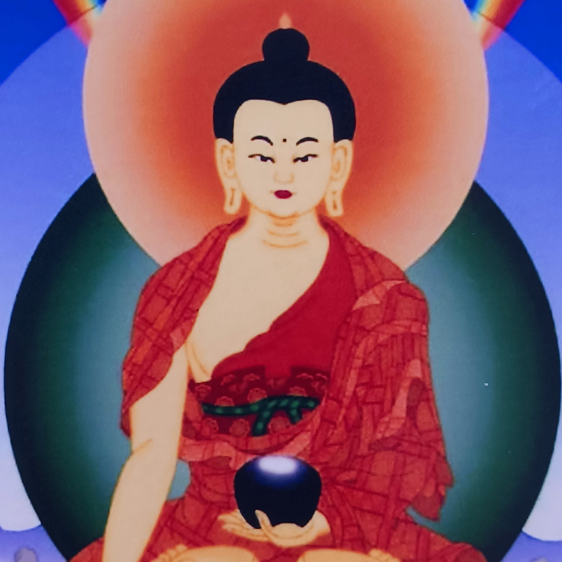 Beautiful small thangka of Shakyamuni Buddha with brocade border. A perfect spiritual art piece for meditation or home altar decoration.