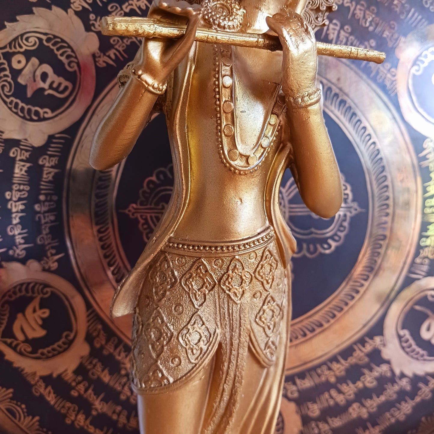Bring divine grace and serenity into your space with this beautifully crafted golden statue of Lord Krishna, one of the most revered and beloved deities in Hinduism. Krishna, the eighth avatar of Vishnu, is known as the god of love, protection, and compassion. 